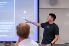 A student speaks during a capstone presentation