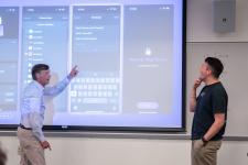 A student answers a question during a capstone presentation