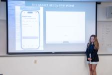 A student begins her capstone presentation