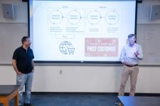 Faculty and judges speak during presentations
