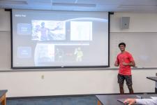 A student speaks during a capstone presentation