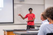 A student speaks during a capstone presentation