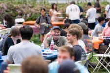students and faculty at a table