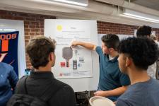 Students explain a capstone poster