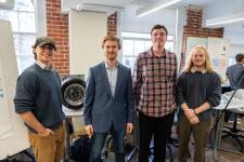 Students pose with their capstone project