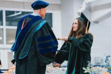 Graduate receives her diploma
