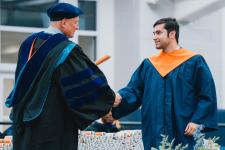 A student receives his diploma