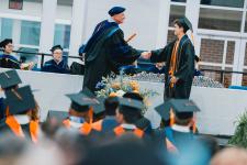 A student receives their diploma