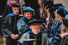Faculty cross the stage