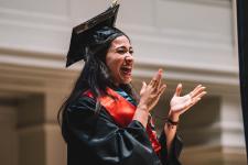 A student claps during the ceremony