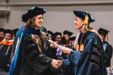 A student receives their diploma