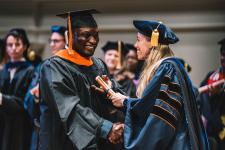 A student receives their diploma