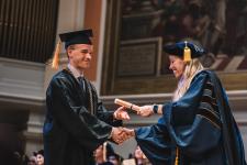 A student receives their diploma