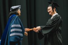 A student receives his diploma
