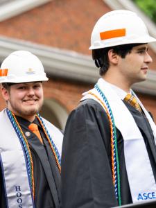 students line up to receive their diplomas