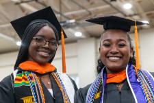 Students wait in line to receive their diplomas