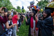 Students greet family on the Lawn