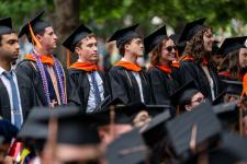 Students stand during Final Exercises