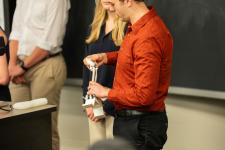 A student shows off a device