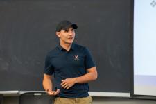 A student speaks during a capstone presentation