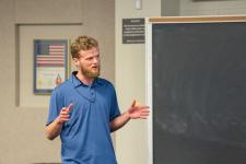 A student speaks during a capstone presentation