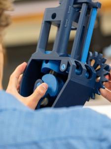 A student examines a model