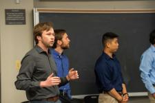 A student speaks during a capstone presentation