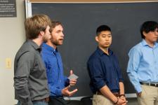 A student speaks during a capstone presentation