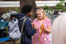 Staff distribute cords to students