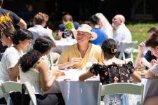 Students and faculty eat during the picnic