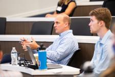 an audience member asks a question during a presentation