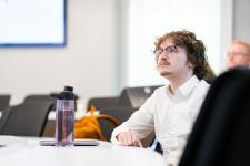 A student in the audience at a presentation