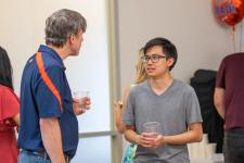 Faculty and students talk at the brunch