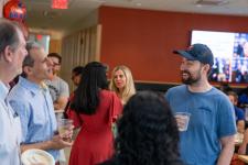 Faculty and students talk at the brunch