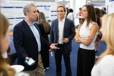 students speak to attendees