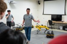 a researcher speaks to attendees about autonomous systems