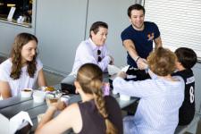 Students and faculty at a picnic table