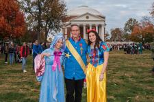 Bill Scherer with his daughters on the Lawn on Halloween