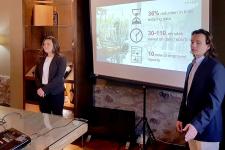 Two people giving a slide presentation