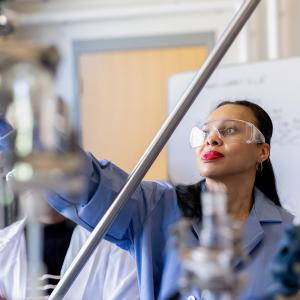 Prof. Lakeshia Taite works in a chemical engineering lab