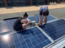 students working on solar panels