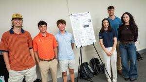 student group with their poster