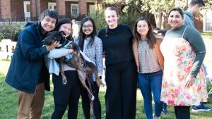 Students with dog at department picnic
