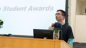 A speaker behind the podium