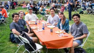 students pose at a table
