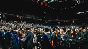 students toss their caps in the air