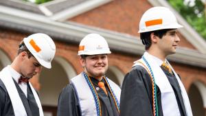 Students wait in line to receive diplomas