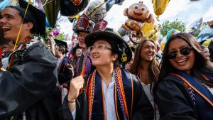 UVA Engineering students at graduation with smiles and balloons