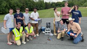 An aerospace engineering capstone team with their custom-built rocket engine