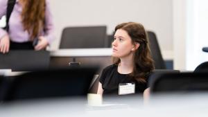 A student watches a presentation at the SIEDS conference